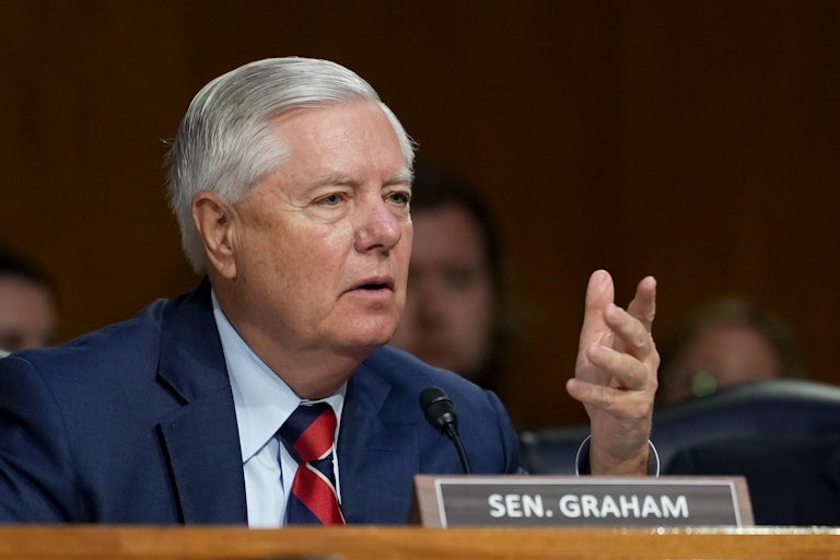 Lindsey Graham gestures and speaks during a Senate hearing