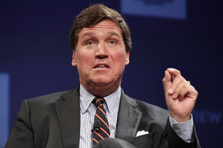 Tucker Carlson makes a weird face while speaking