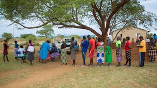 People queue for Covid vaccination at Buwi Secondary School in Chinhoyi, Zimbabwe