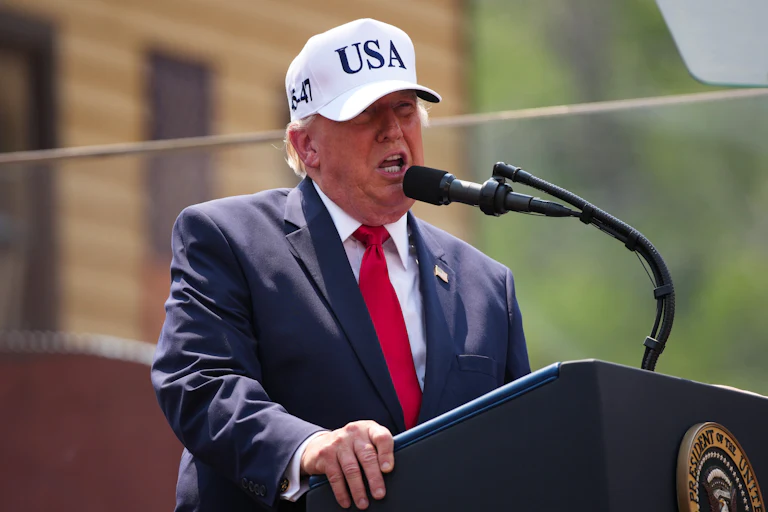 Donald Trump speaks at a podium