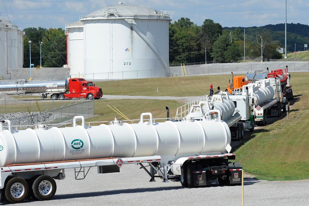 Tanker trucks line up at a Colonial Pipeline facility.