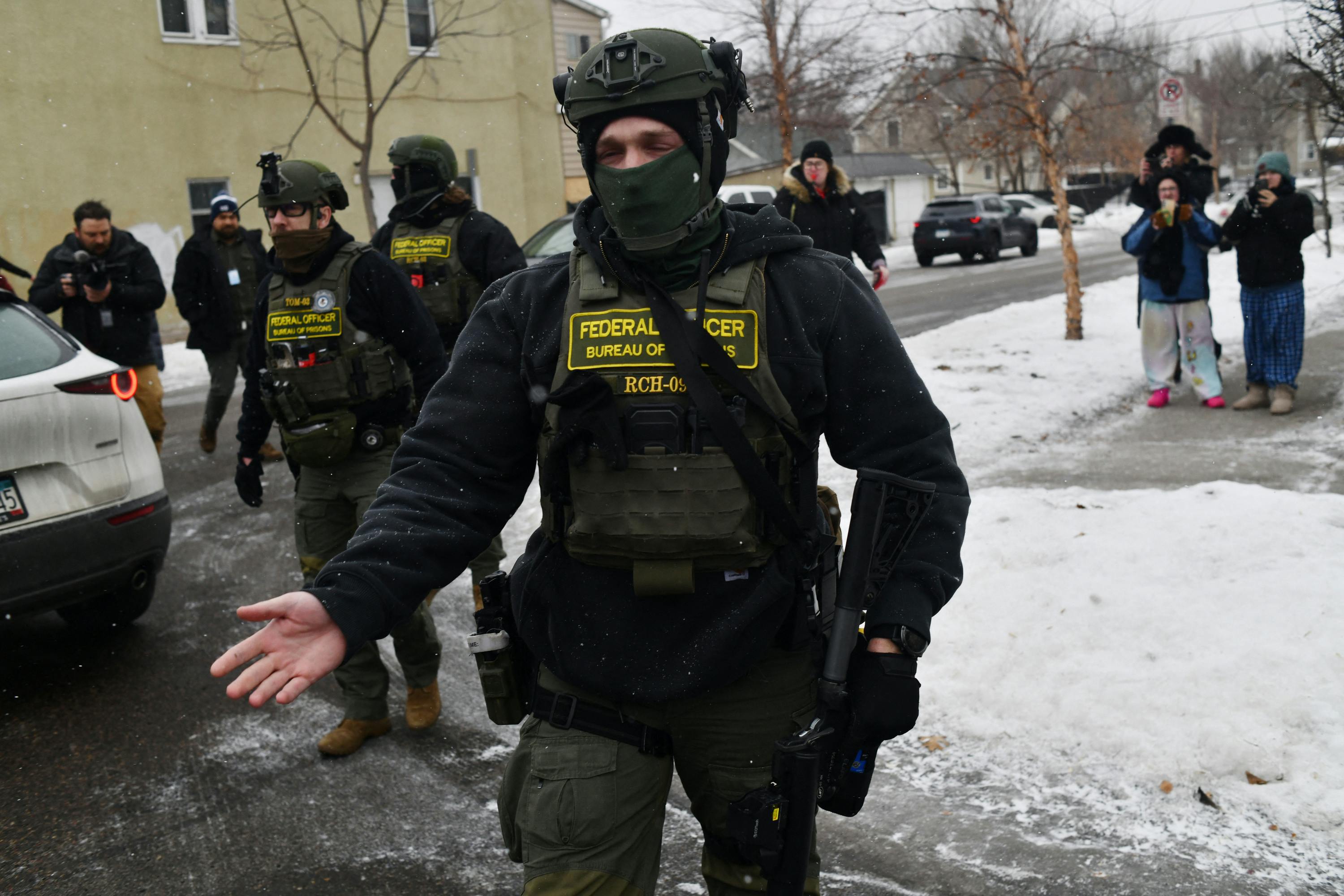Federal agents patrol the Frogtown neighborhood of Minneapolis while anti-ICE activists warn the community about their presence.