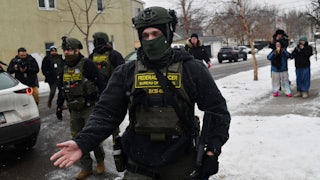 Federal agents patrol the Frogtown neighborhood of Minneapolis while anti-ICE activists warn the community about their presence.