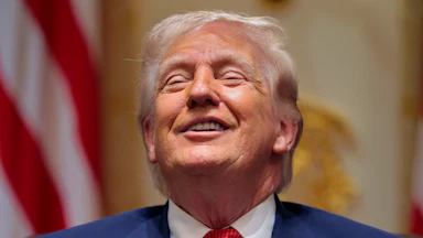 President Trump smiles in a Cabinet meeting