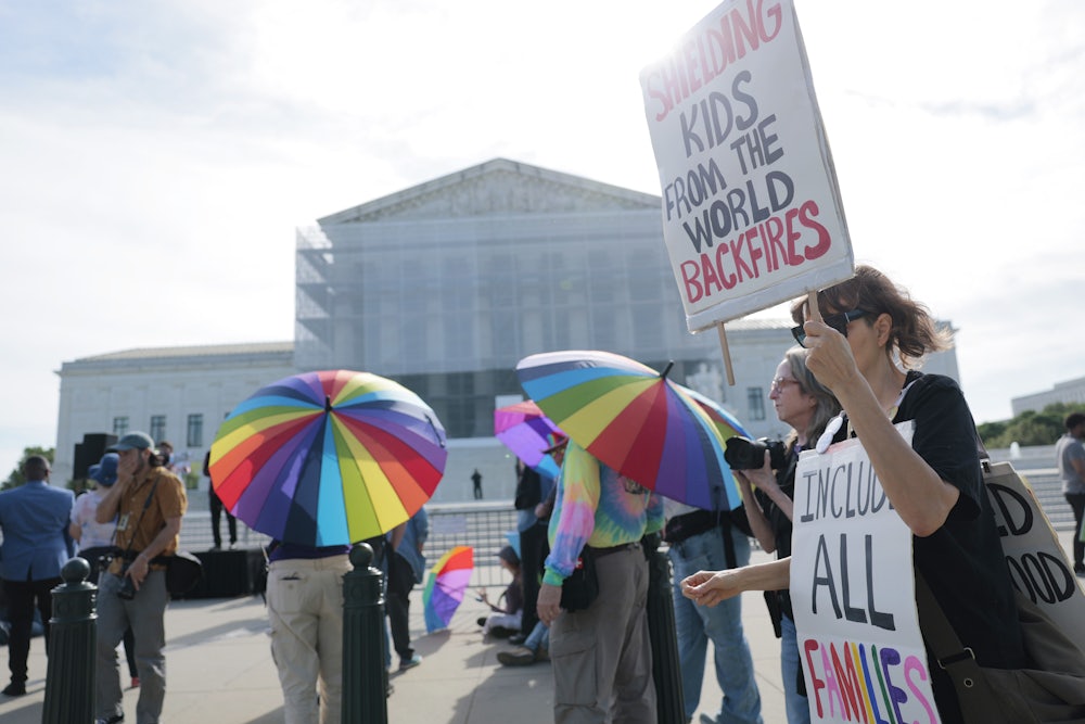 Demonstrators in support of LGBTQ+ rights and against book bans outside the U.S. Supreme Court