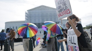Demonstrators in support of LGBTQ+ rights and against book bans outside the U.S. Supreme Court
