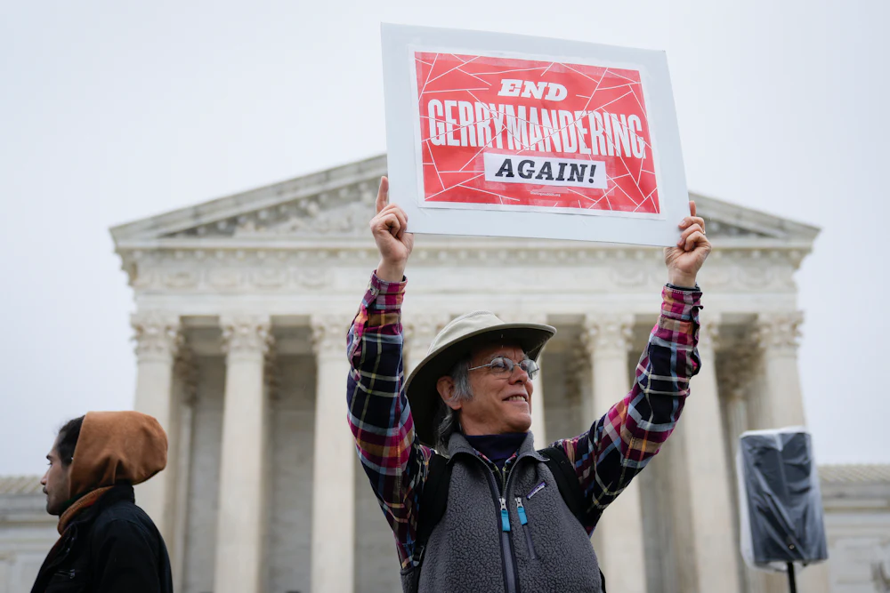 Voting rights activists rally outside the U.S. Supreme Court.