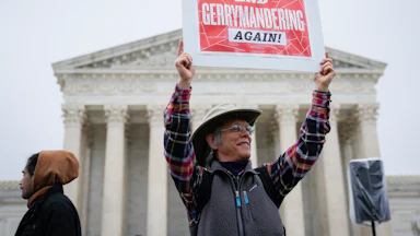 Voting rights activists rally outside the U.S. Supreme Court.