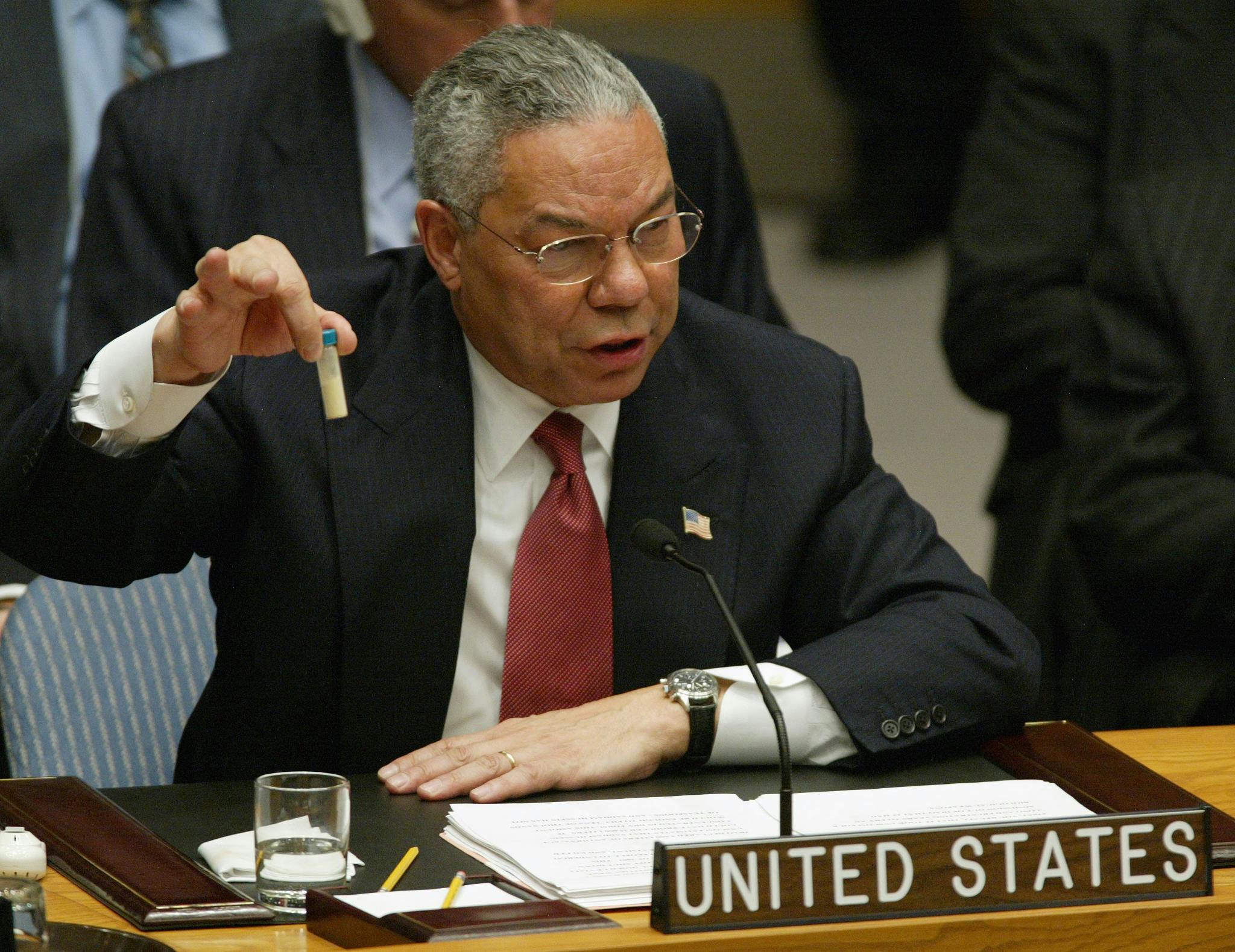 US Secretary of State Colin Powell holds up a vial that he said was the size that could be used to hold anthrax as he addresses the United Nations Security Council .