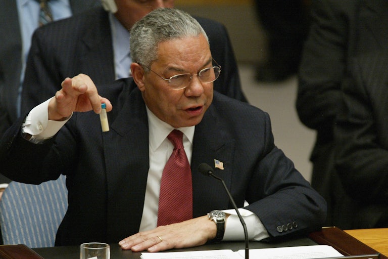 US Secretary of State Colin Powell holds up a vial that he said was the size that could be used to hold anthrax as he addresses the United Nations Security Council .