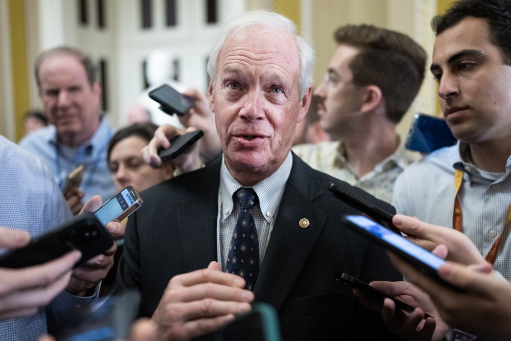 Wisconsin Senator Ron Johnson talks with reporters after the senate luncheons in the U.S. Capitol.