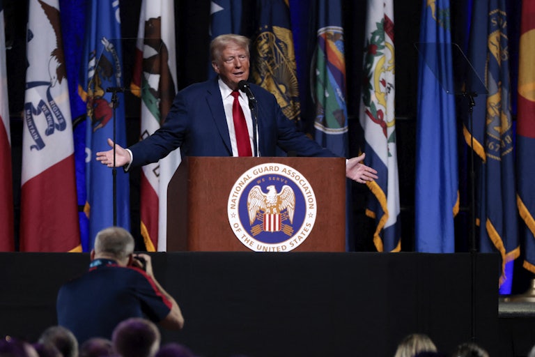 Donald Trump gestures while speaking at a campaign event