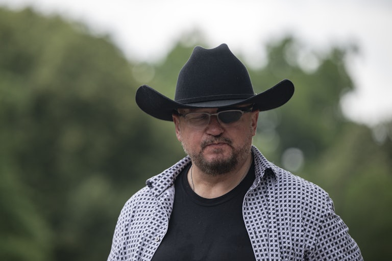 Oath Keepers leader Stewart Rhodes stands at a press conference in Washington, D.C.