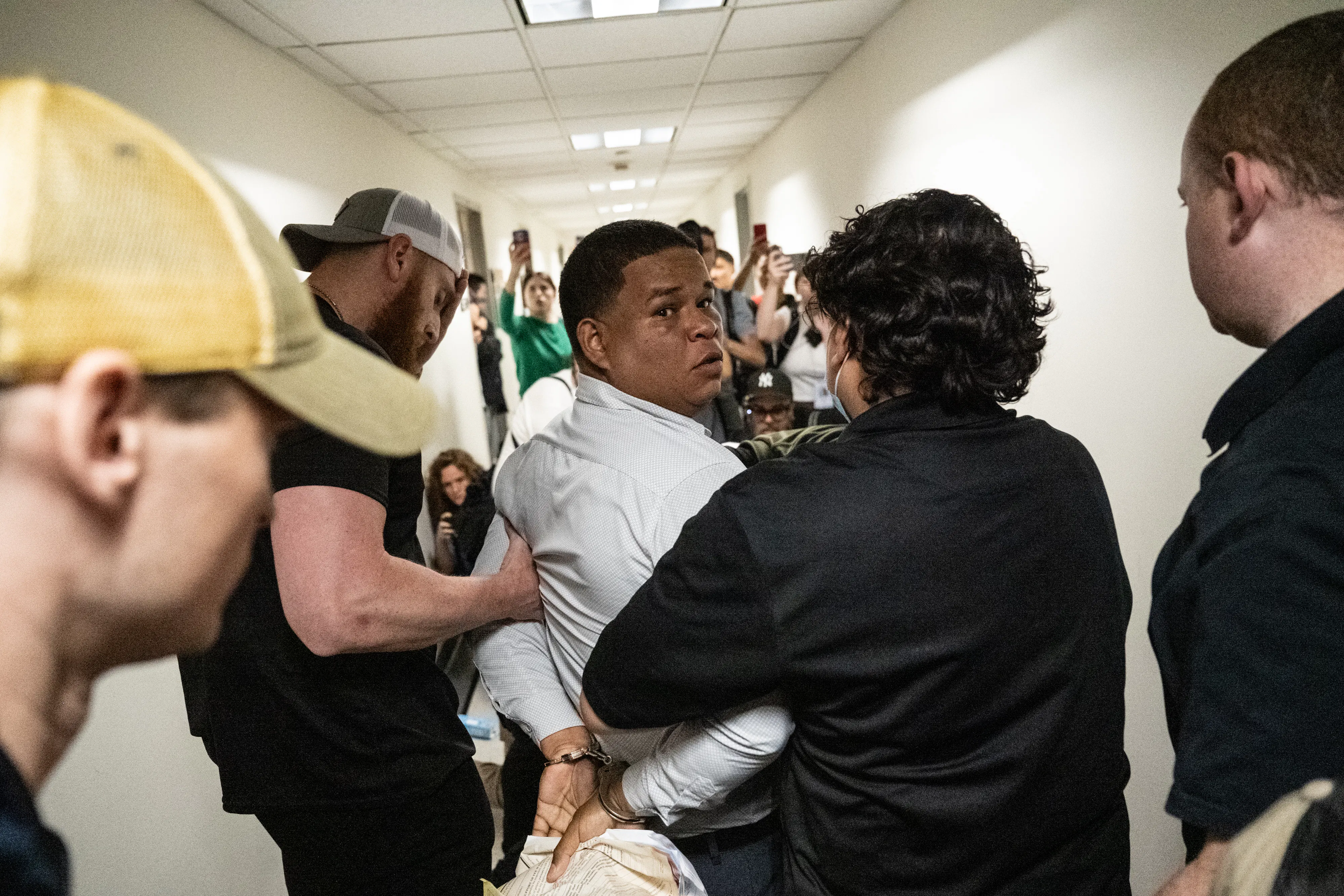 An immigrant is detained by ICE agents as he exits an immigration courtroom hearing at the Jacob K. Javits Federal Building on June 6, 2025 in New York City. 