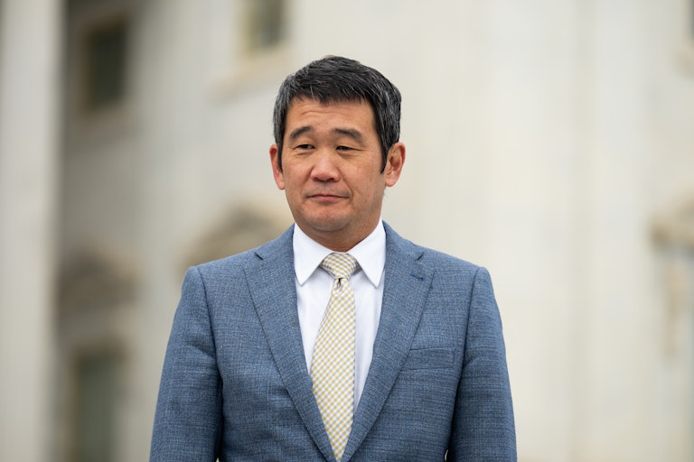 Representative Dave Min stands outside the Capitol