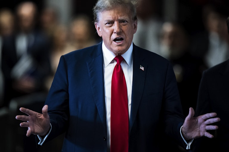 Donald Trump gestures with his hands as he speaks