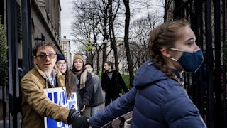 striking student workers hold hands on the picket line at Columbia University