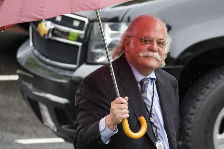 Ty Cobb holds up an umbrella