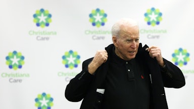 Joe Biden prepares to leave after receiving his second dose COVID-19 vaccination.