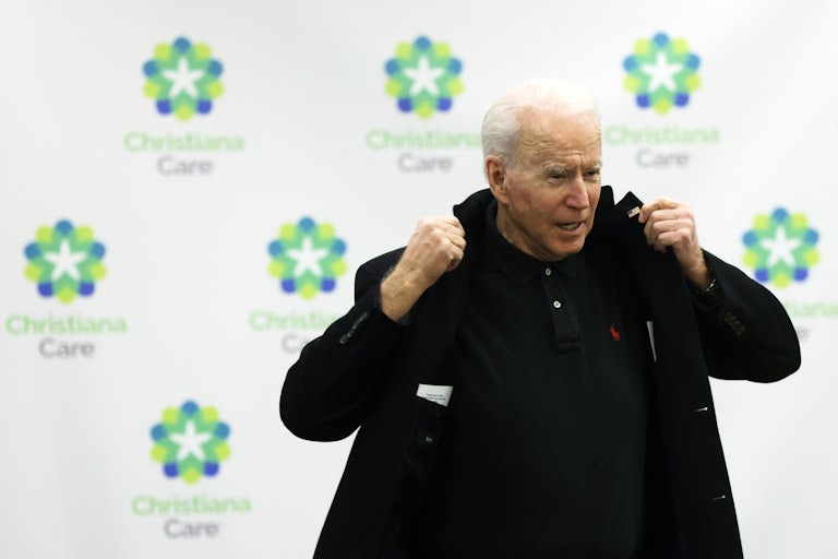 Joe Biden prepares to leave after receiving his second dose COVID-19 vaccination.