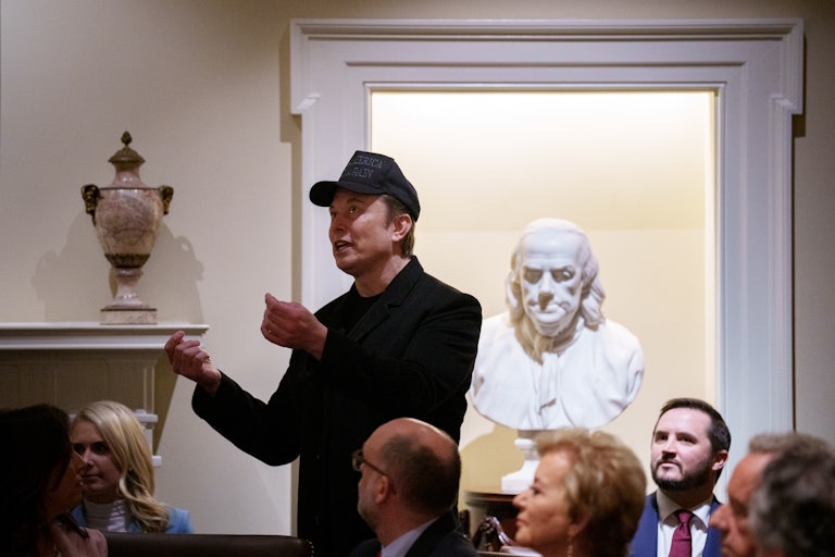 Elon Musk gestures while speaking during Donald Trump's Cabinet meeting.