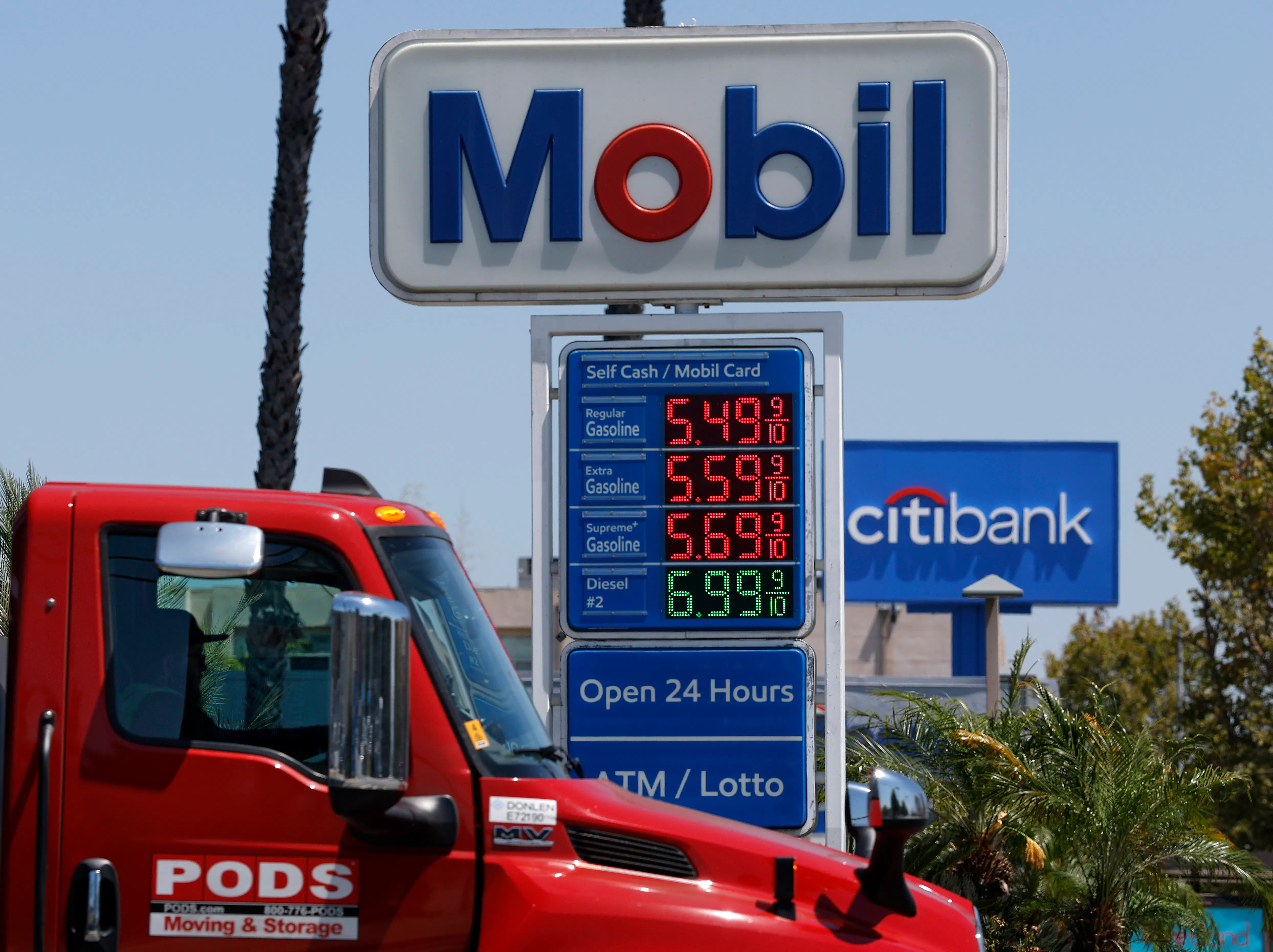 Gas station sign showing gas prices starting at $5.49/gallon.