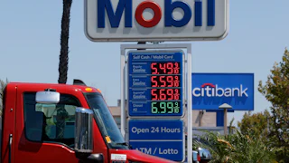 Gas station sign showing gas prices starting at $5.49/gallon.