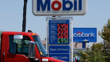 Gas station sign showing gas prices starting at $5.49/gallon.
