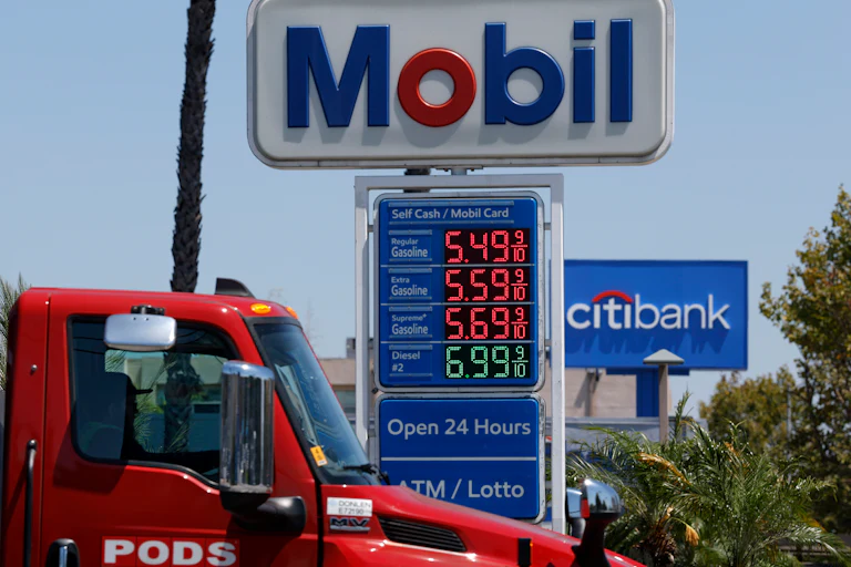 Gas station sign showing gas prices starting at $5.49/gallon.