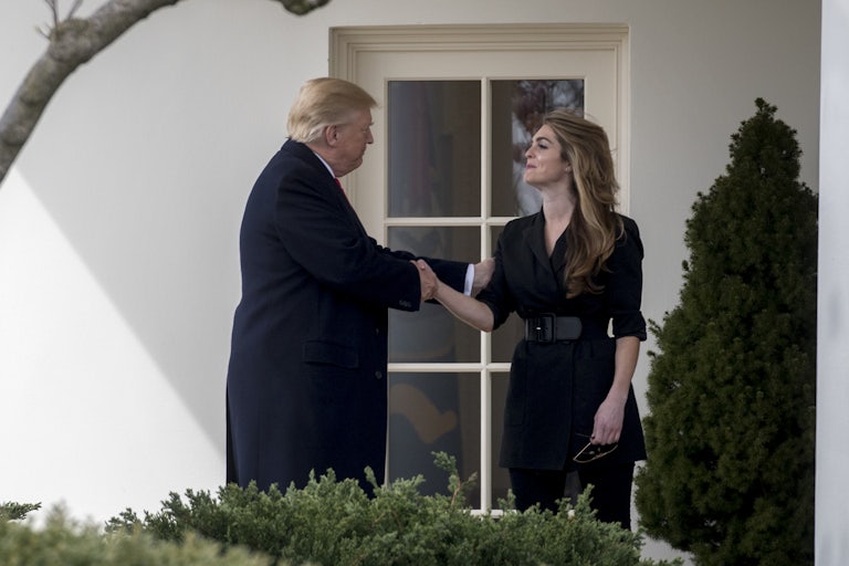 Donald Trump and Hope Hicks shake hands