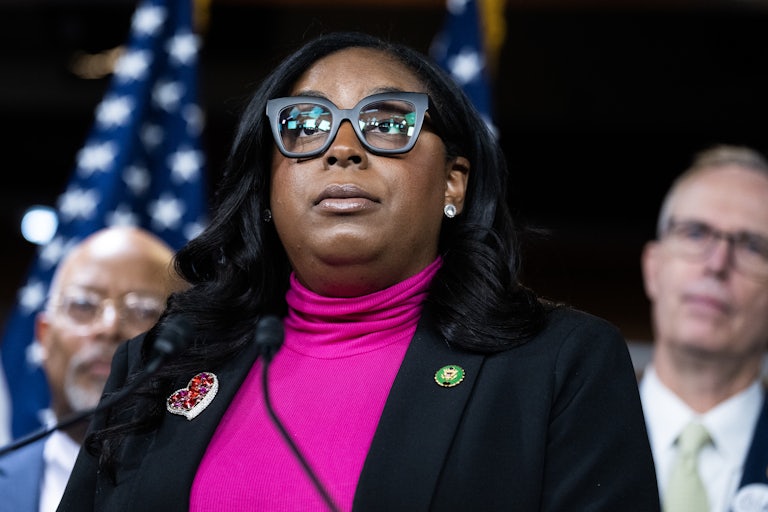 Representative LaMonica McIver stands during a press conference