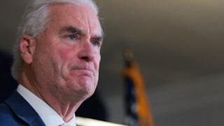 Representative Tom Emmer presses his lips together.