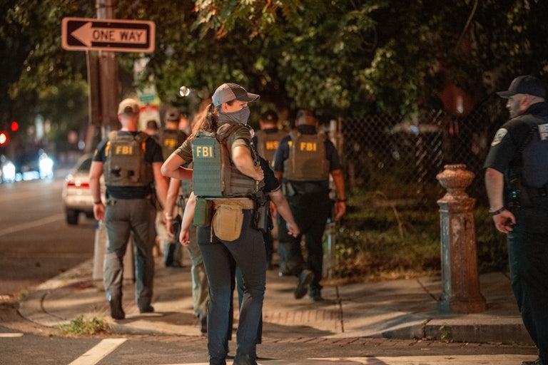 FBI agents patrol a street in Washington, D.C.