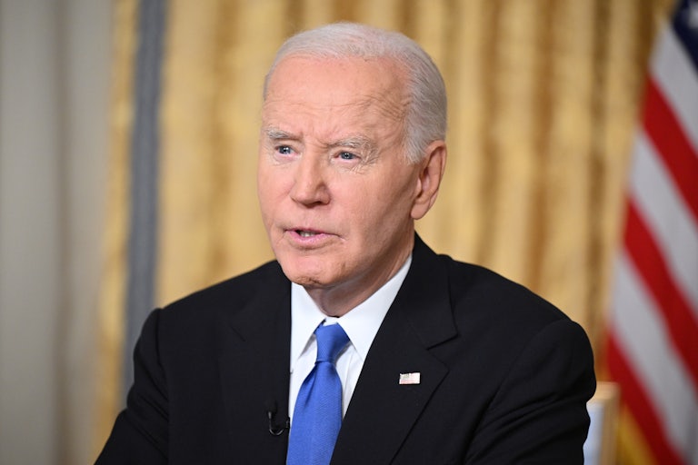 Joe Biden speaks at his desk in the Oval Office.