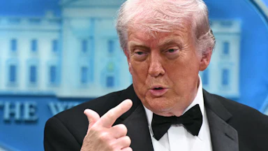 President Donald Trump points to himself while speaking in the White House briefing room