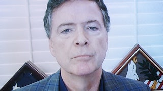 Former FBI Director James Comey appears on a screen.