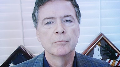Former FBI Director James Comey appears on a screen.