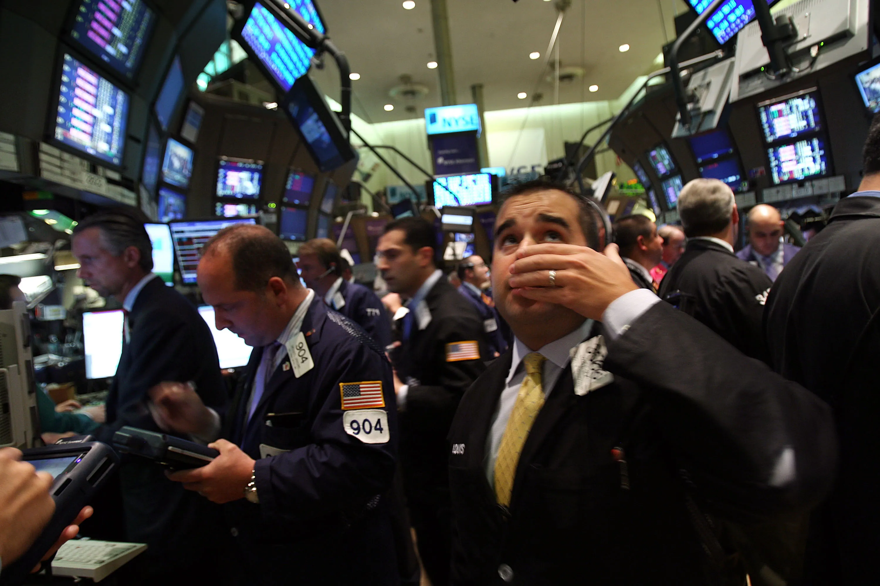  A trader works on the floor of the New York Stock Exchange September 15, 2008 in New York City. In afternoon trading the Dow Jones Industrial Average fell over 500 points as U.S. stocks suffered a steep loss after news of Merrill Lynch & Co. Inc was selling itself to Bank of America Corp, the financial firm Lehman Brothers Holdings Inc. filed for Chapter 11 bankruptcy protection, and insurance giant American International Group Inc. (AIG) was approved to secure capital from itself.