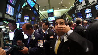 A trader works on the floor of the New York Stock Exchange September 15, 2008 in New York City. In afternoon trading the Dow Jones Industrial Average fell over 500 points as U.S. stocks suffered a steep loss after news of Merrill Lynch & Co. Inc was selling itself to Bank of America Corp, the financial firm Lehman Brothers Holdings Inc. filed for Chapter 11 bankruptcy protection, and insurance giant American International Group Inc. (AIG) was approved to secure capital from itself.