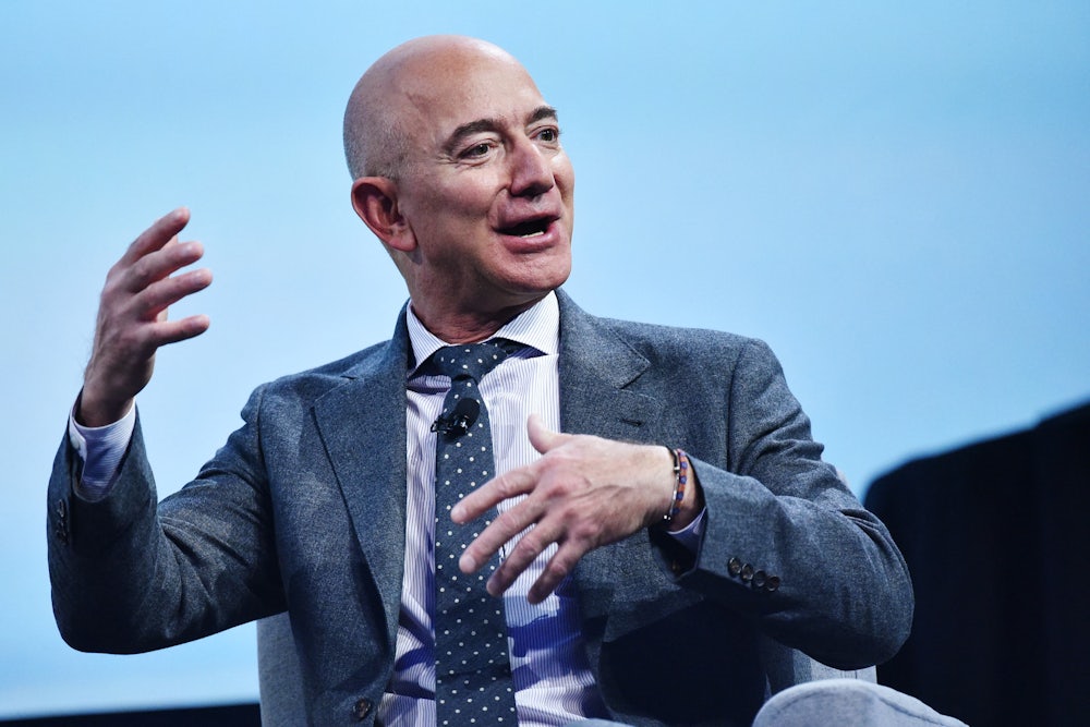 Washington Post owner Jeff Bezos gesticulates at a conference.
