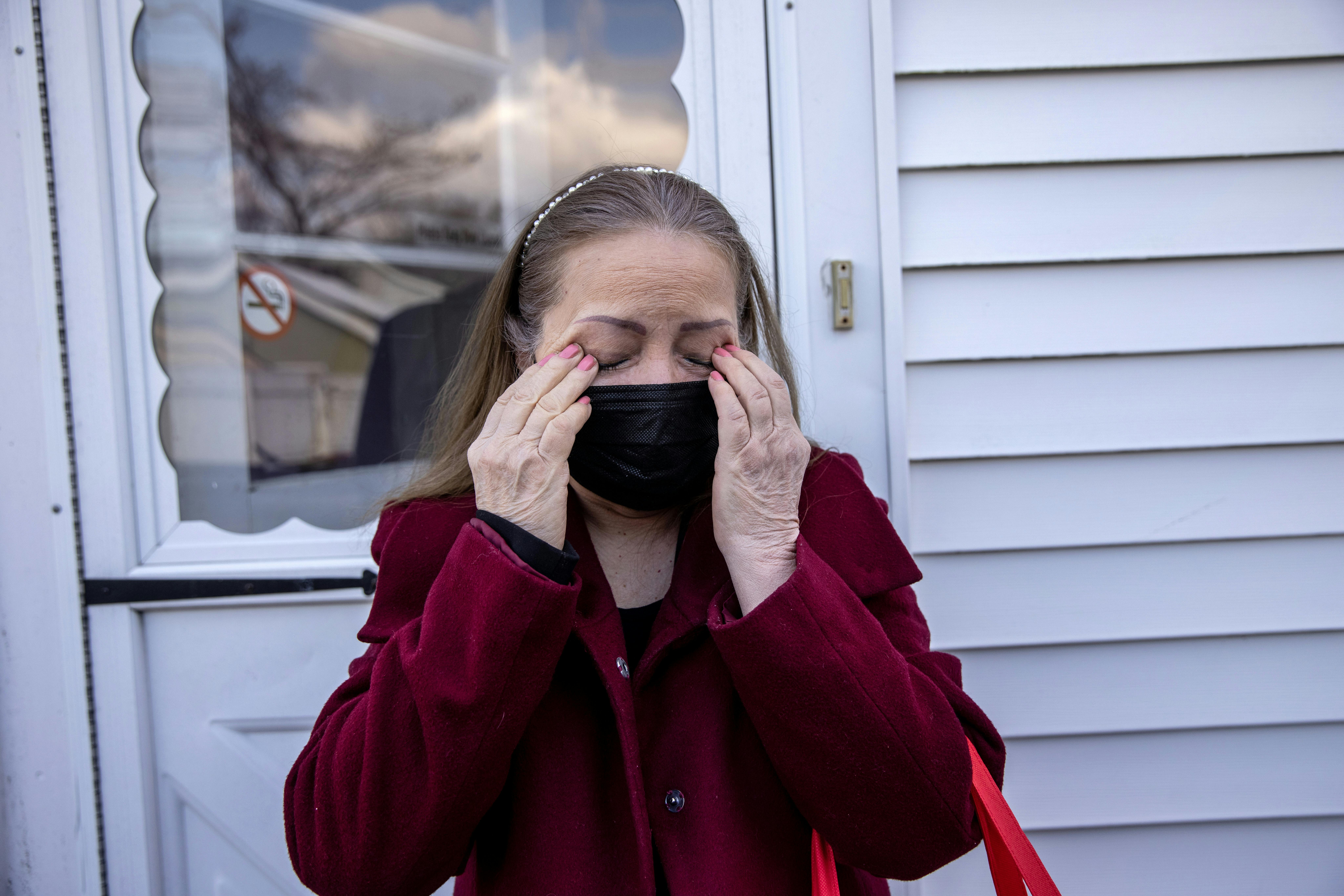 Maria Romero, a Covid "long hauler," weeps