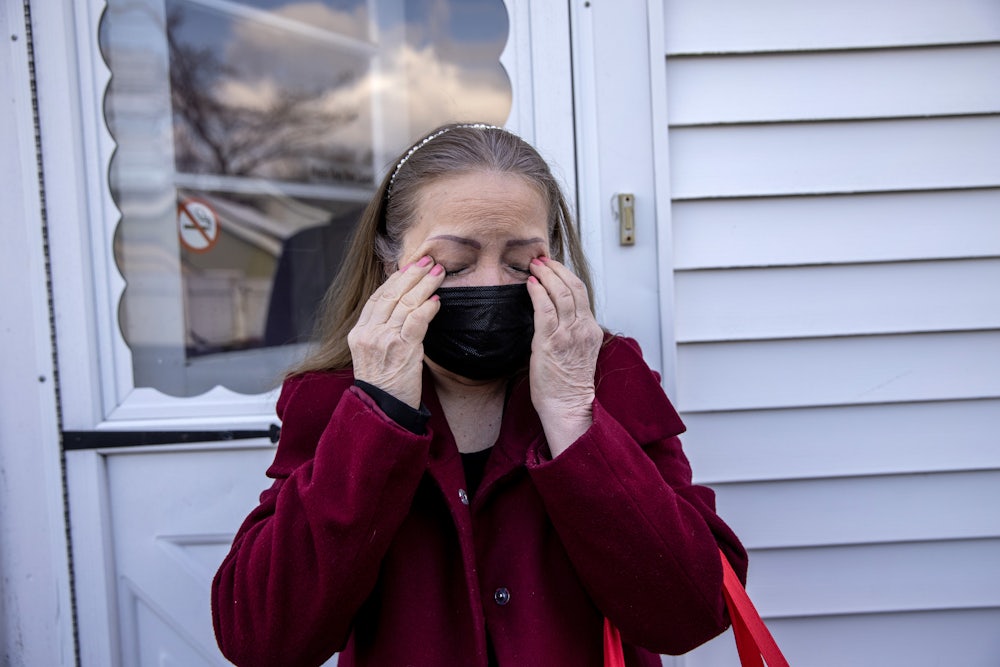 Maria Romero, a Covid "long hauler," weeps