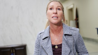 Marjorie Taylor Greene walks through a hallway in the Capitol.