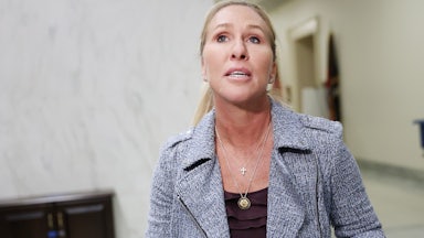 Marjorie Taylor Greene walks through a hallway in the Capitol.