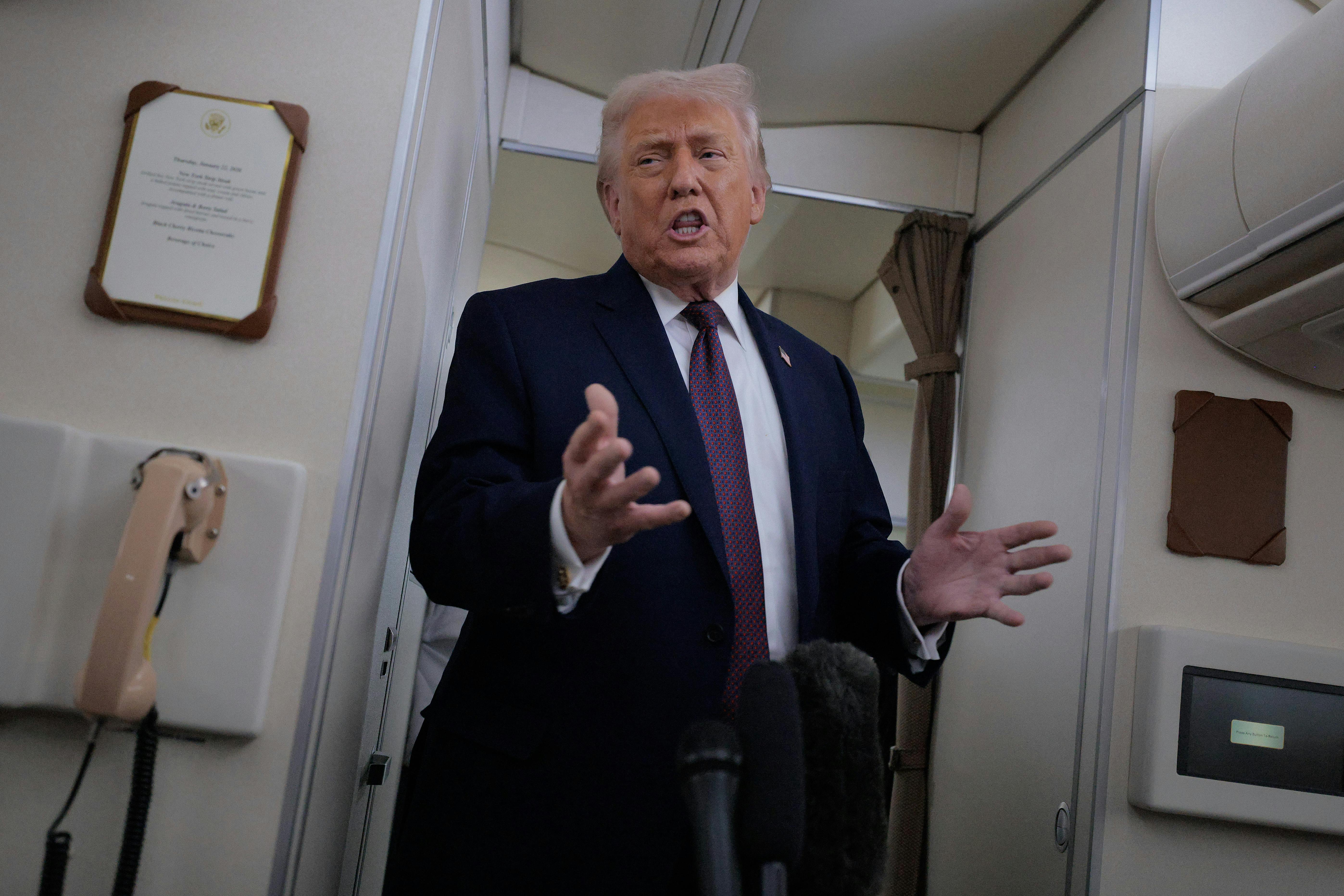 Donald Trump speaks aboard Air Force One.