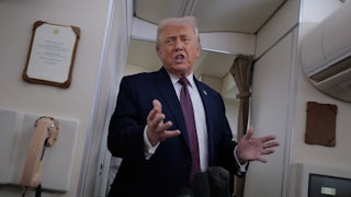 Donald Trump speaks aboard Air Force One.