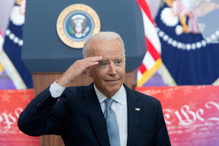 President Biden offers a salute to the crowd during his voting rights speech.