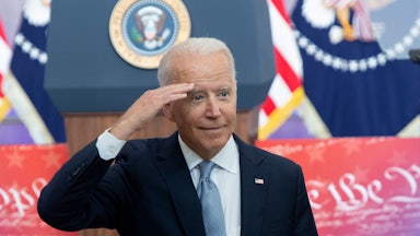 President Biden offers a salute to the crowd during his voting rights speech.