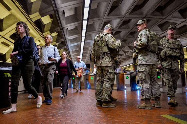 National Guard troops from South Carolina stand in Foggy Bottom Metro Station in Washington, D.C.