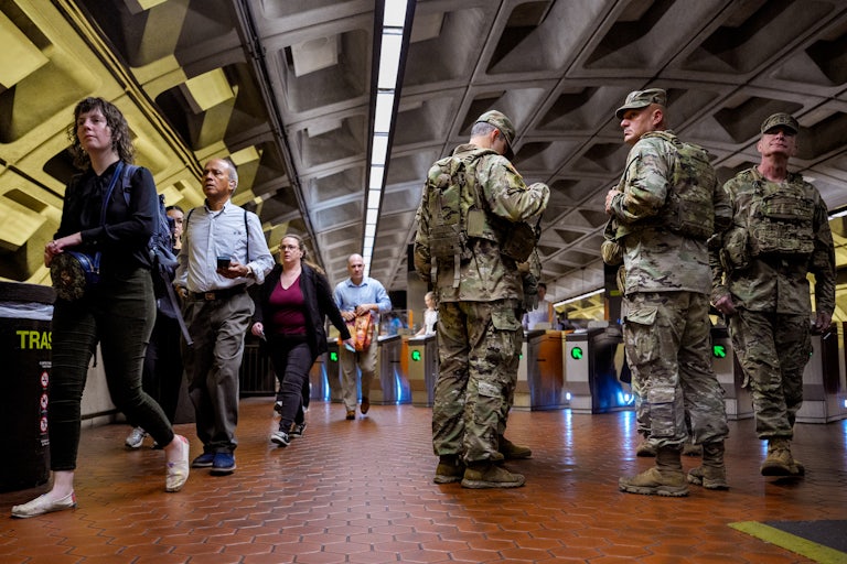 National Guard troops from South Carolina stand in Foggy Bottom Metro Station in Washington, D.C.